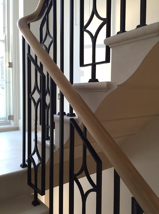 ExcelScarsdale-3 Elegant, continuous steel staircase balustrade with oak handrails
