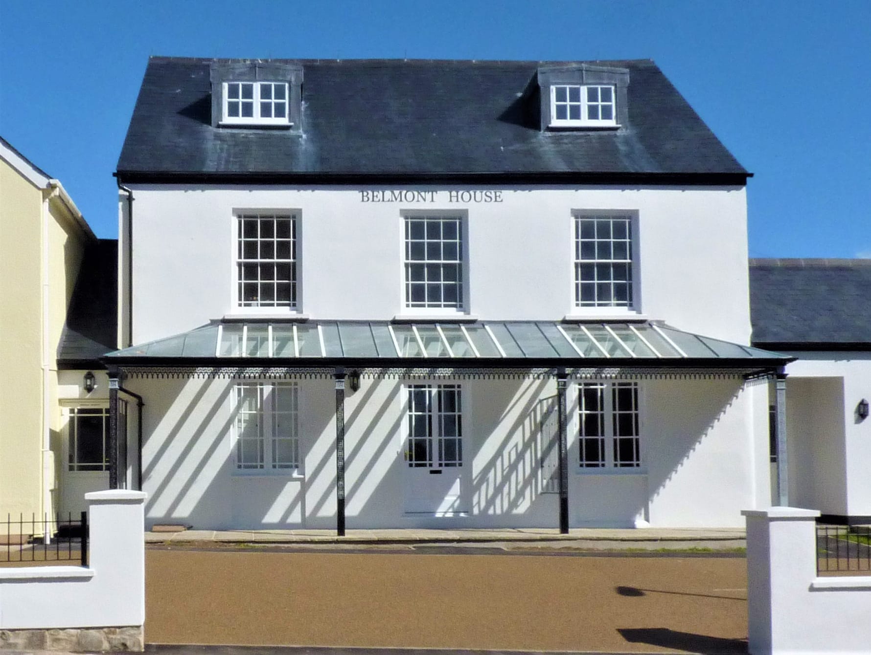 A straight and hipped glazing bar roof with glazing bays above window openings